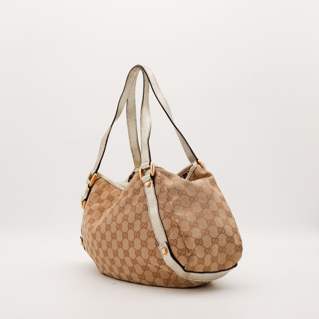 Sac Gucci Hobo toile monogrammée vue de trois-quarts occasion authentique — AMANA Vintage