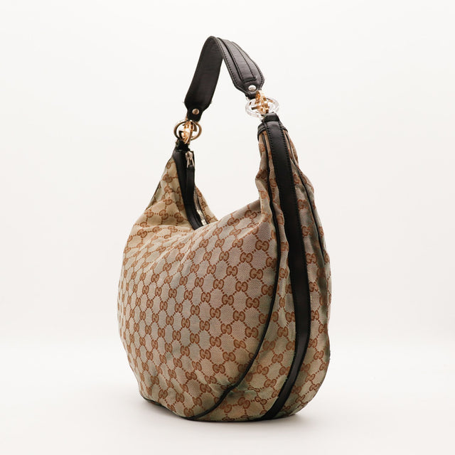 Sac Gucci Hobo toile monogrammée vue de profil avec anse cuir marron foncé occasion authentique — AMANA Vintage