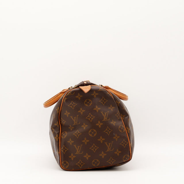 Détail des anses en cuir vachette Louis Vuitton Speedy 35 occasion authentique — AMANA Vintage