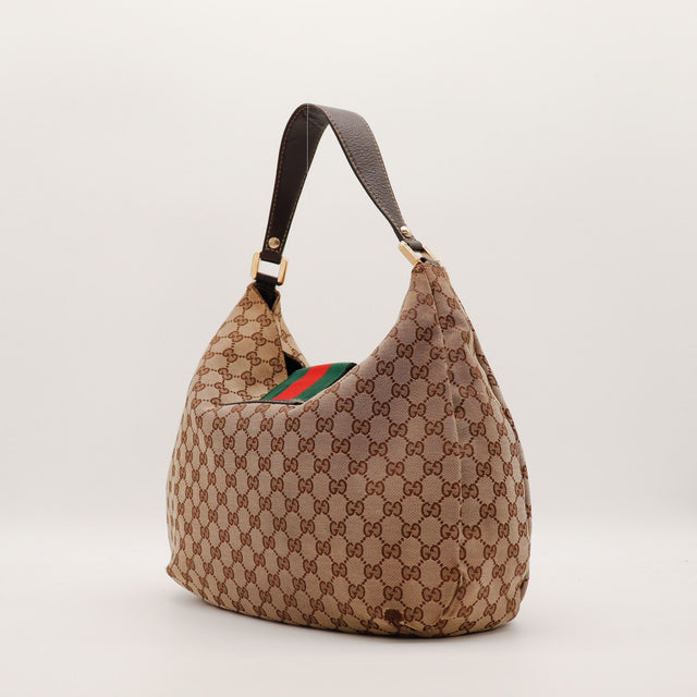Vue de trois quarts sac Gucci Hobo Web silhouette souple toile monogrammée — AMANA Vintage