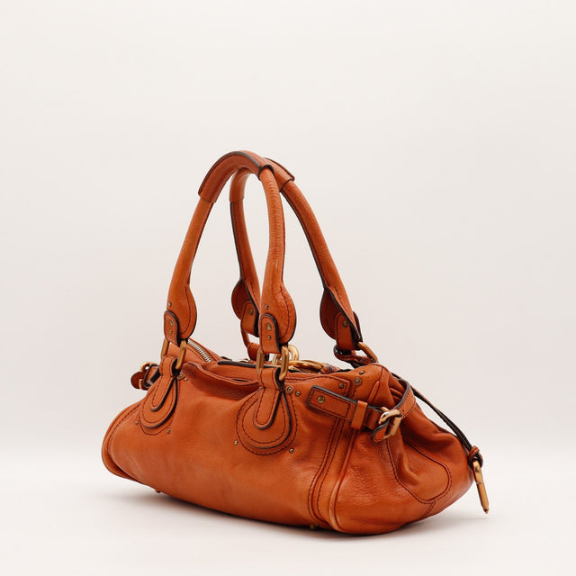 Détail des anses Chloé Paddington cuir grainé terracotta occasion authentique — AMANA Vintage