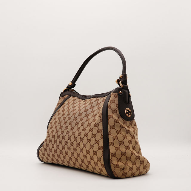 Hobo Gucci vue de trois quarts gauche toile monogrammée occasion — AMANA Vintage