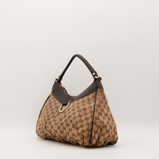 Sac Gucci Hobo toile monogrammée vue de trois quarts occasion authentique — AMANA Vintage