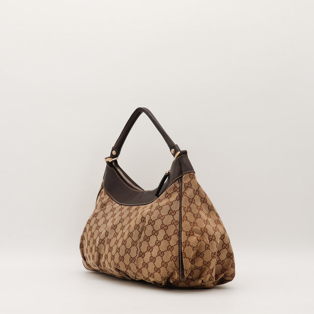 Sac Gucci Hobo toile monogrammée vue de côté occasion authentique — AMANA Vintage