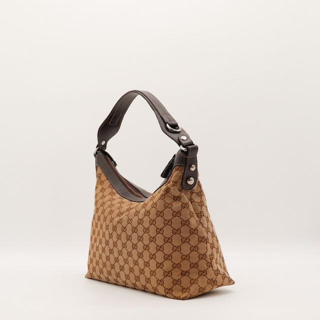 Sac Gucci Hobo toile monogrammée vue de trois quarts occasion authentique — AMANA Vintage