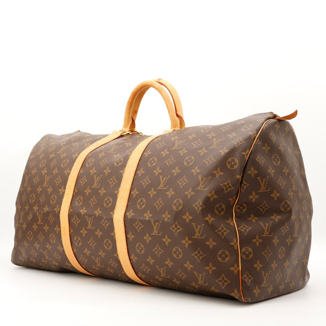 Louis Vuitton Keepall 60 vue de trois quarts toile Monogram patine caramel occasion — AMANA Vintage
