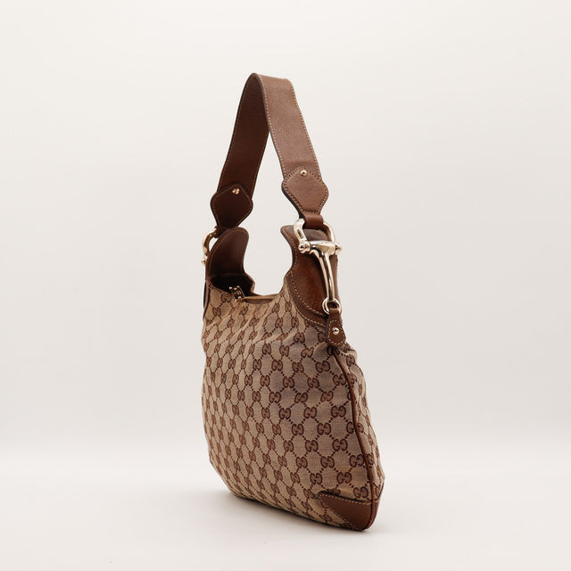 Sac Gucci Hobo profil bandoulière cuir et pièce métallique dorée — AMANA Vintage