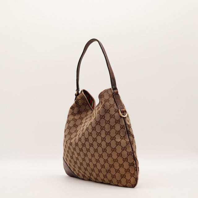 Sac Gucci Hobo toile monogrammée vue de côté occasion authentique — AMANA Vintage