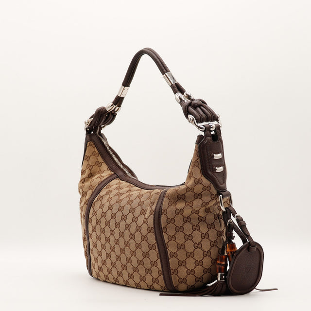Sac Gucci Hobo toile monogrammée vue de trois quarts occasion authentique — AMANA Vintage