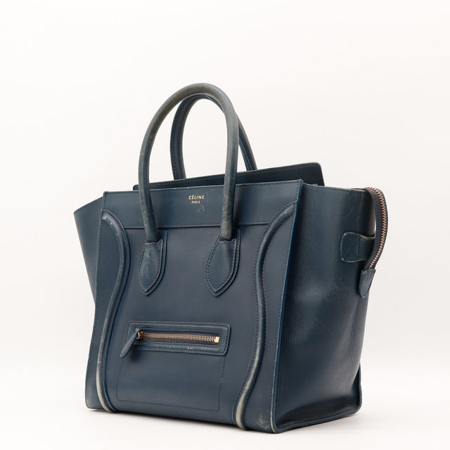 Détail des coins inférieurs Céline Luggage Mini cuir bleu marine occasion authentique — AMANA Vintage