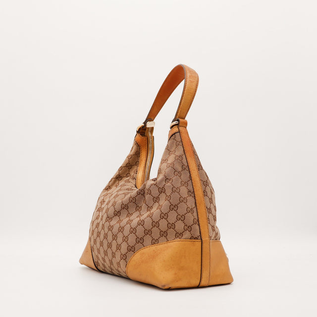 Vue latérale Gucci Hobo Interlocking G montrant le fond en cuir usé — AMANA Vintage
