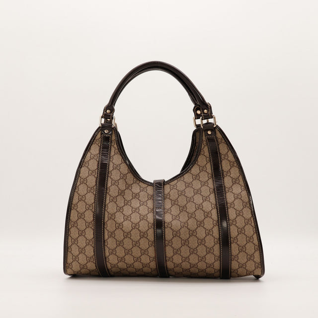 Hobo Gucci vue de face arrière toile monogrammée cuir verni chocolat — AMANA Vintage