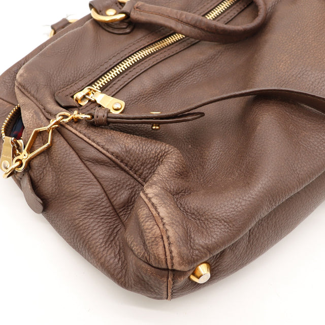Détail des fermetures à glissière Miu Miu Bowler cuir de chèvre grainé marron bronze occasion authentique — AMANA Vintage