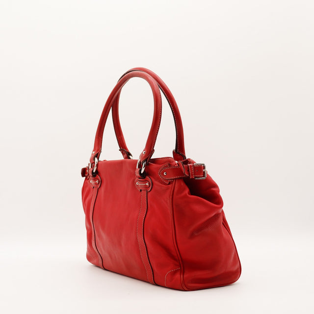 Sac à main Dior cuir rouge profil et boucle latérale occasion authentique — AMANA Vintage