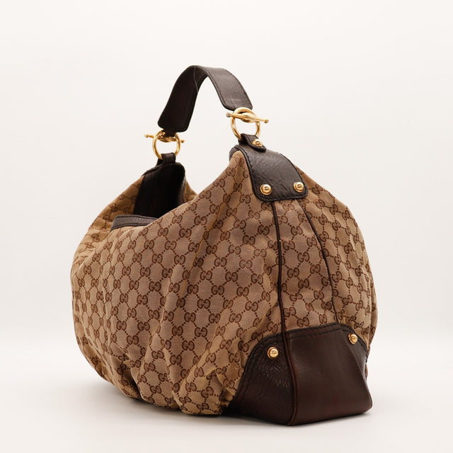 Hobo Gucci vue de côté gauche toile monogrammée cuir marron — AMANA Vintage