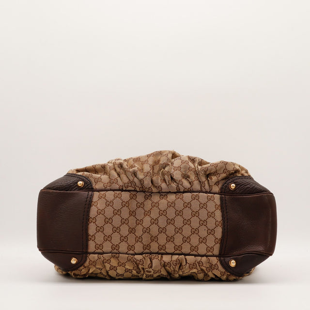 Hobo Gucci vue du dessous toile monogrammée et coins cuir marron — AMANA Vintage