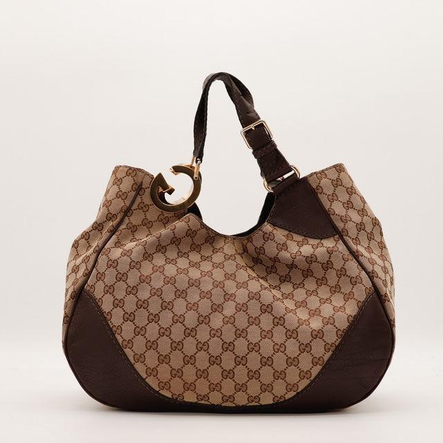 Hobo Gucci toile monogrammée vue de face arrière cuir marron occasion — AMANA Vintage