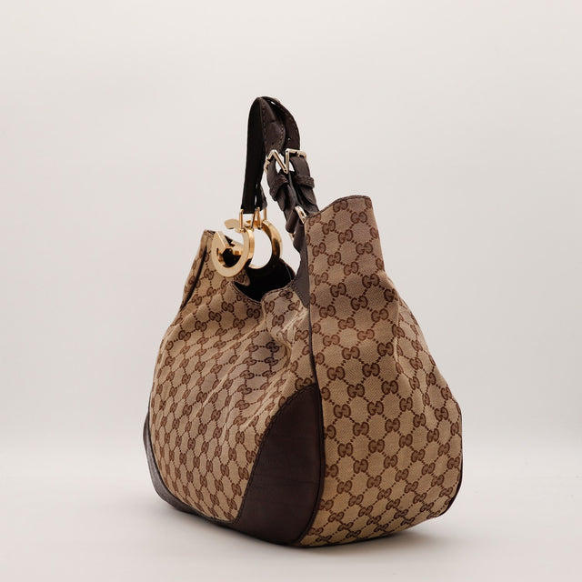 Hobo Gucci vue de profil droit toile monogrammée anses cuir marron — AMANA Vintage