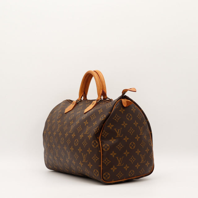 Louis Vuitton Speedy 30 vue trois quarts angle gauche toile monogramme patine caramel — AMANA Vintage