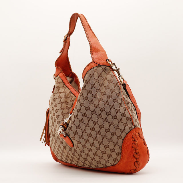 Sac Gucci New Jackie vue de trois quarts cuir orange tressé occasion authentique — AMANA Vintage