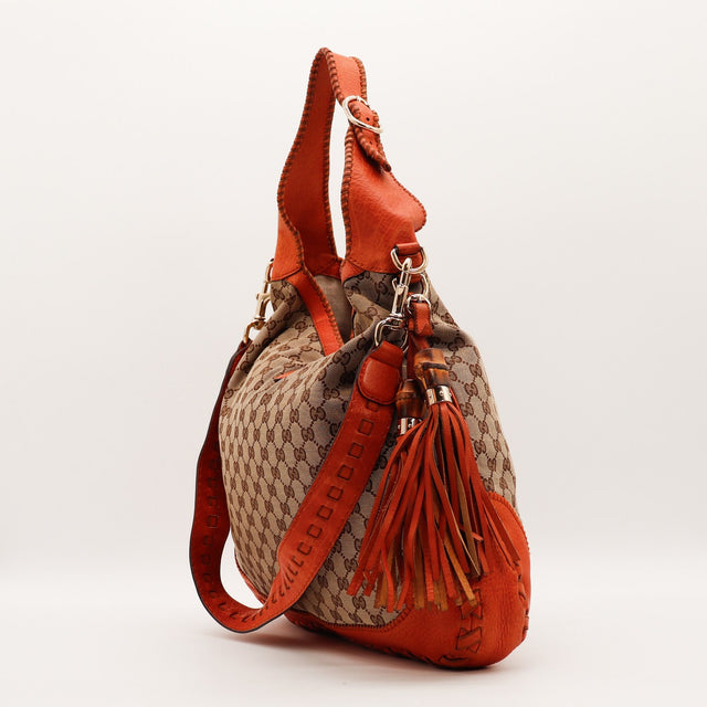 Sac Gucci New Jackie vue de profil pompons bambou occasion authentique — AMANA Vintage