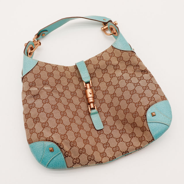 Sac Gucci New Jackie vue en plongée fermoir piston occasion authentique — AMANA Vintage