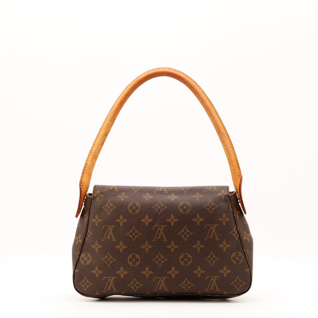 Détail de l'anse Louis Vuitton Mini Looping cuir vachette patiné occasion authentique — AMANA Vintage
