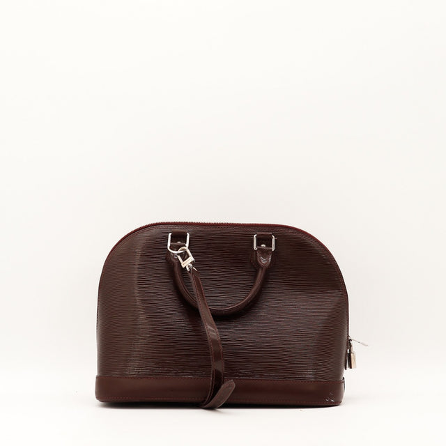 Vue de profil Louis Vuitton Alma PM cuir Épi bordeaux occasion authentique — AMANA Vintage