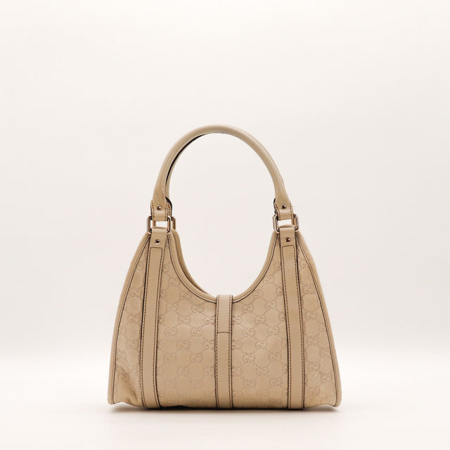 Vue de profil Gucci Hobo cuir Guccissima beige occasion authentique — AMANA Vintage