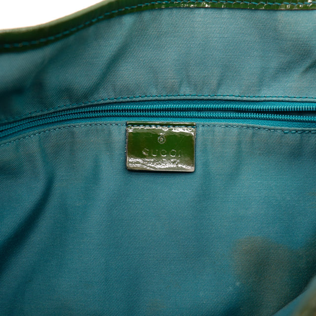 Intérieur doublure turquoise et plaque Gucci — AMANA Vintage