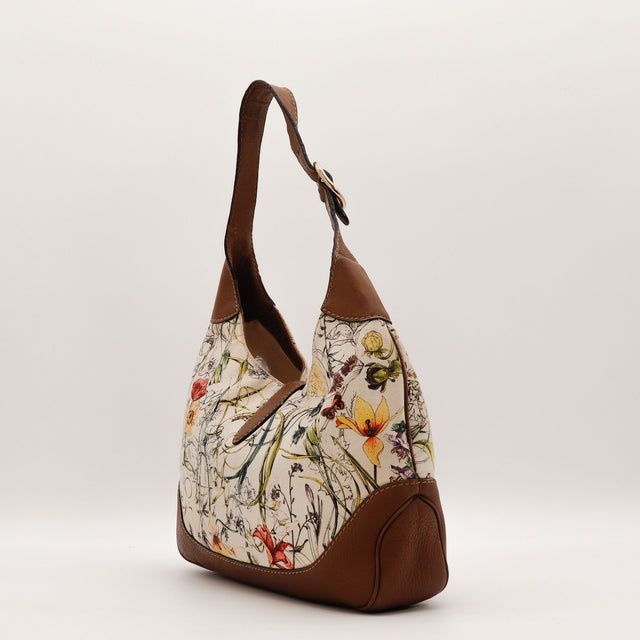 Détail du fermoir piston doré Gucci Jackie toile Flora — AMANA Vintage