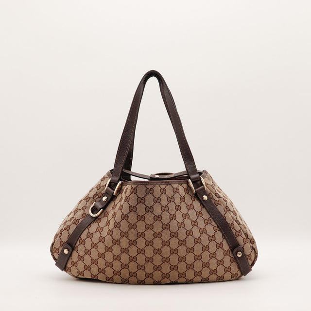 Sac Gucci Hobo toile monogrammée beige vue de côté occasion authentique — AMANA Vintage