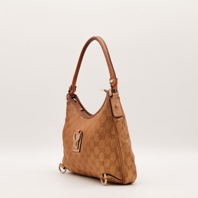 Vue de dos Gucci Hobo toile monogrammée beige occasion authentique — AMANA Vintage