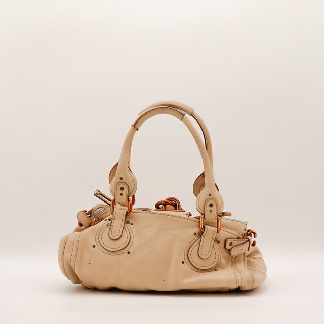 Détail du cadenas Chloé Paddington cuir de veau grainé beige occasion authentique — AMANA Vintage