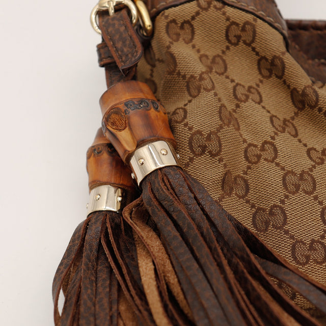 Détail pompons bambou et cuir Gucci New Jackie occasion authentique — AMANA Vintage