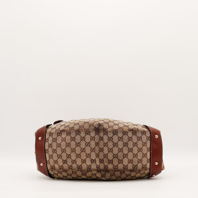 Détail du mors de cheval doré Gucci Hobo Pelham occasion authentique — AMANA Vintage