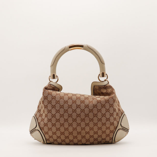 Sac Gucci Indy Hobo toile monogrammée vue de côté occasion authentique — AMANA Vintage