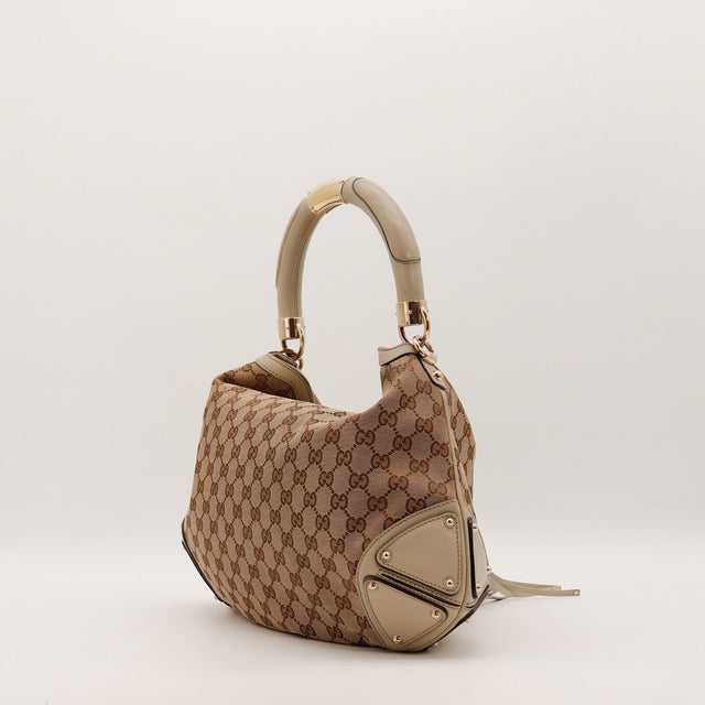 Détail de l'anse rigide en cuir Gucci Indy Hobo occasion authentique — AMANA Vintage