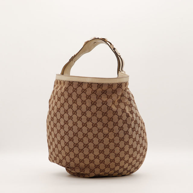 Sac Gucci Hobo Horsebit toile monogrammée beige vue de profil occasion authentique — AMANA Vintage