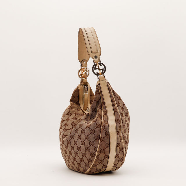 Vue de dos Gucci Hobo Interlocking G toile monogrammée beige occasion authentique — AMANA Vintage
