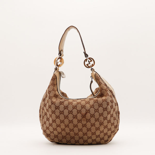 Vue de côté Gucci Hobo Interlocking G toile monogrammée beige occasion authentique — AMANA Vintage