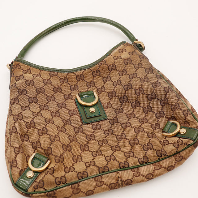 Détail anneau en D doré et cuir verni vert Gucci Hobo — AMANA Vintage