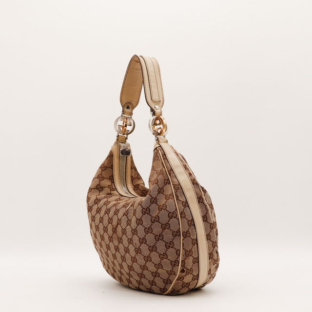 Détail de l'anse en cuir clair Gucci Hobo Interlocking G occasion authentique — AMANA Vintage