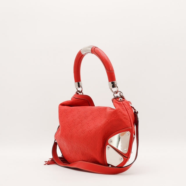 Détail des plaques d'angle Gucci Indy Hobo cuir Guccissima rouge occasion authentique — AMANA Vintage