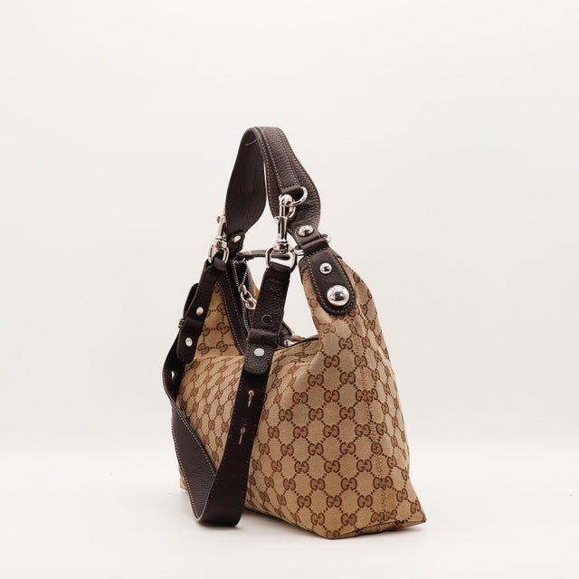 Détail des bordures en cuir marron du sac Gucci Hobo Horsebit occasion authentique — AMANA Vintage