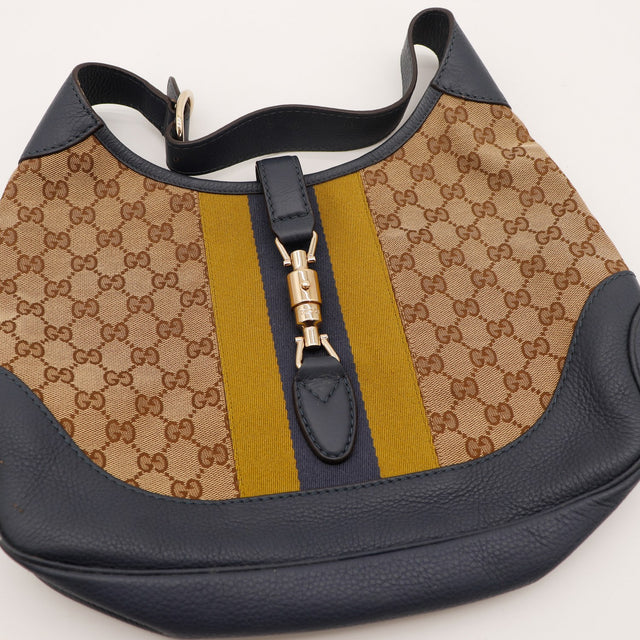 Détail bande Web et fermoir piston doré Gucci Jackie occasion authentique — AMANA Vintage