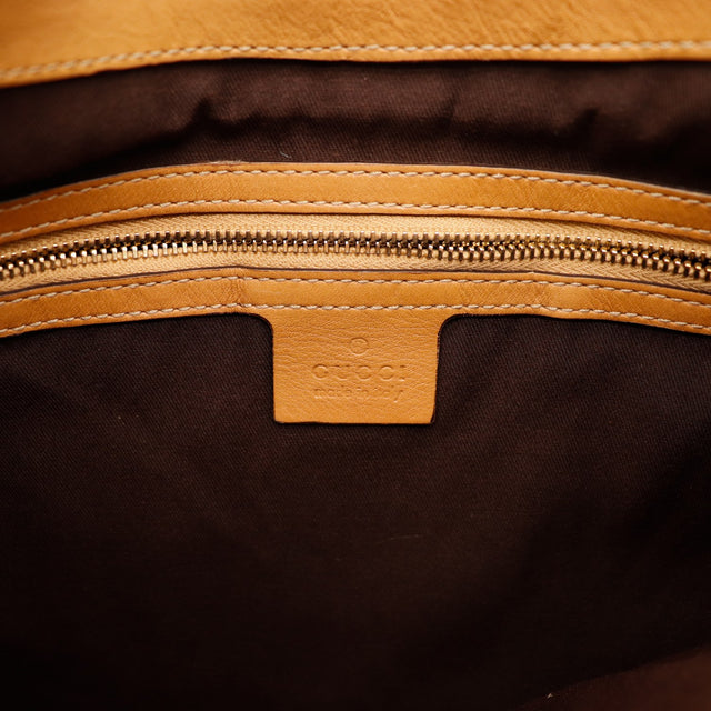 Intérieur doublure textile marron et estampille Gucci Made in Italy — AMANA Vintage
