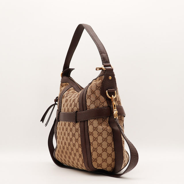 Détail des bandes de cuir marron Gucci Hobo occasion authentique — AMANA Vintage