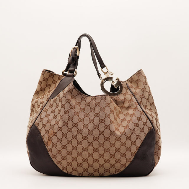 Vue de côté Gucci Hobo Charlotte toile monogrammée beige et ébène occasion authentique — AMANA Vintage