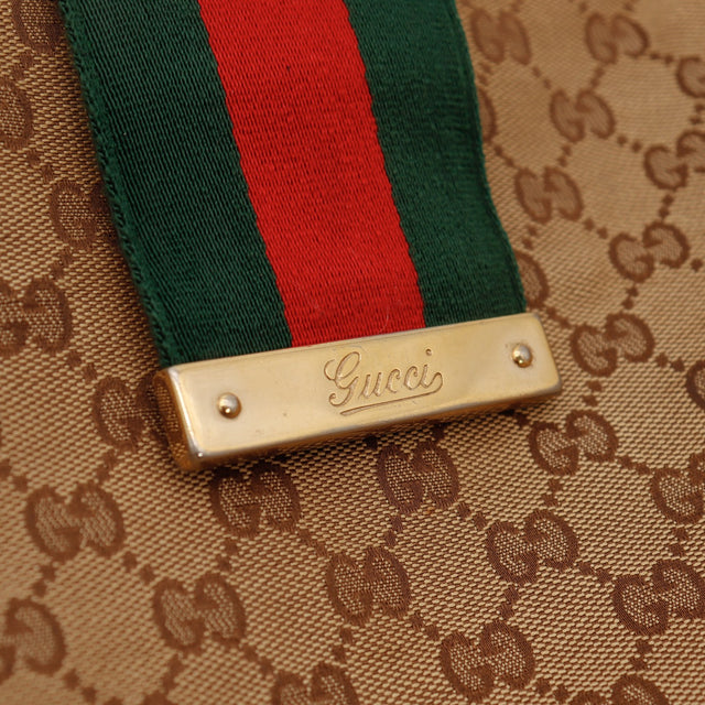 Détail plaque Gucci et bande Web du sac Hobo occasion authentique — AMANA Vintage
